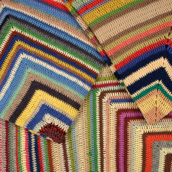 Three crocheted striped woollen blankets,